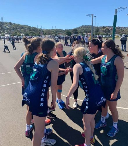 southern suburbs junior team on court with hands in before game