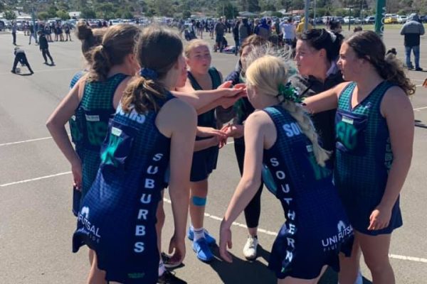southern suburbs junior team on court with hands in before game
