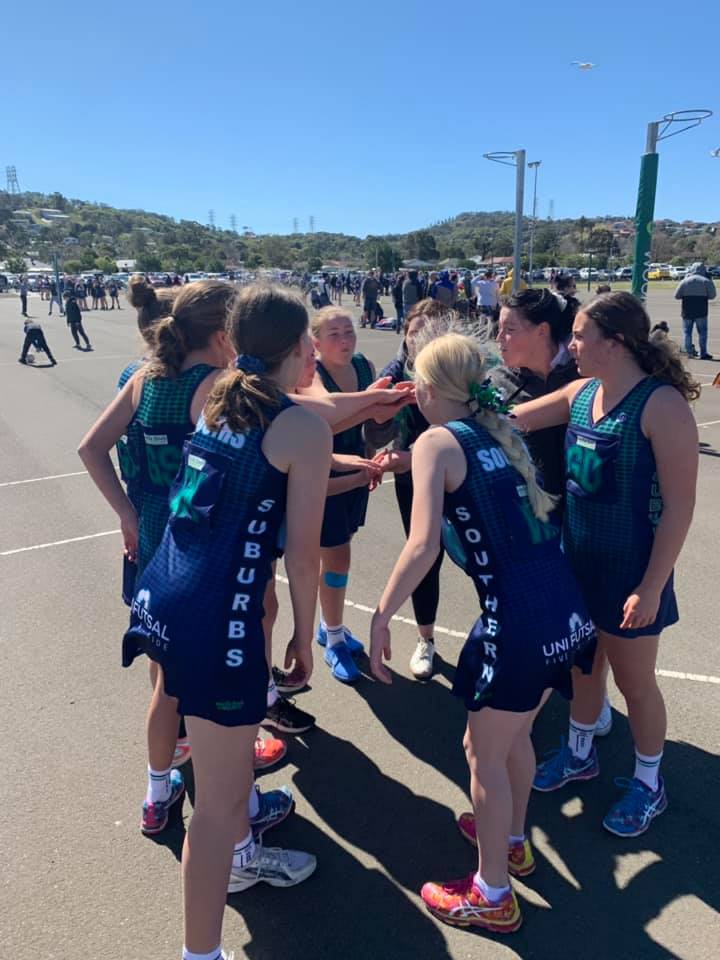 southern suburbs junior team on court with hands in before game